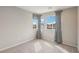 Bedroom with neutral carpet, light gray walls, baseboards and trim along with natural light at 6622 Palm Branch St, North Las Vegas, NV 89086