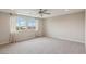Bright bedroom features a ceiling fan, recessed lighting, and large windows that offer lots of natural light at 6622 Palm Branch St, North Las Vegas, NV 89086