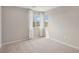 Bedroom with neutral carpet, light gray walls, baseboards and trim along with natural light at 6622 Palm Branch St, North Las Vegas, NV 89086