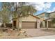 Charming two-story home featuring a two-car garage and low-maintenance desert landscaping at 6622 Palm Branch St, North Las Vegas, NV 89086