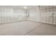 Spacious garage with epoxy floors and high ceilings, perfect for parking and storage solutions at 6622 Palm Branch St, North Las Vegas, NV 89086