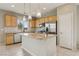 Bright kitchen featuring an island, stainless appliances, and granite countertops at 6622 Palm Branch St, North Las Vegas, NV 89086