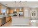 Open kitchen featuring a center island, stainless steel appliances, granite counters and ample cabinetry at 6622 Palm Branch St, North Las Vegas, NV 89086
