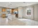 Open-concept design combines living space and kitchen featuring an island with stainless steel appliances and backyard view at 6622 Palm Branch St, North Las Vegas, NV 89086