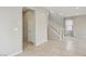 Open floor plan showcases a staircase, neutral colors, and tiled floor leading to other parts of the house at 6622 Palm Branch St, North Las Vegas, NV 89086