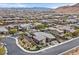 A modern home with desert landscaping and a private backyard patio is featured in an aerial view of the community at 6690 Interstellar St, Las Vegas, NV 89135