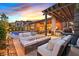 Outdoor living space features a cozy seating area, built-in BBQ, and refreshing swimming pool at 6690 Interstellar St, Las Vegas, NV 89135
