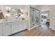 Bathroom showcasing a walk-in shower, a double vanity, and modern lighting at 6690 Interstellar St, Las Vegas, NV 89135