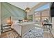 Sunlit bedroom featuring a cozy bed, decorative wall, and modern desk area at 6690 Interstellar St, Las Vegas, NV 89135