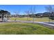 A scenic community park with picnic tables, green lawns, and walking paths offers a serene setting for outdoor activities at 6690 Interstellar St, Las Vegas, NV 89135