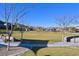 Expansive community park with lush green space, walking paths, and seating areas offers residents a relaxing outdoor retreat at 6690 Interstellar St, Las Vegas, NV 89135