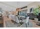 Open dining room featuring stylish light fixture and sliding doors to outside at 6690 Interstellar St, Las Vegas, NV 89135