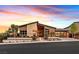 Striking single-story home with modern design, professional landscaping, and a glass-paneled garage at 6690 Interstellar St, Las Vegas, NV 89135