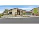 Beautiful home featuring a modern facade, desert landscaping, and a glass garage door at 6690 Interstellar St, Las Vegas, NV 89135