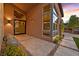 Inviting front entrance featuring desert landscaping, modern pavers, and an oversized glass door at 6690 Interstellar St, Las Vegas, NV 89135