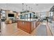Gourmet kitchen boasts a large island, stainless steel appliances, and an open layout connecting to the living area at 6690 Interstellar St, Las Vegas, NV 89135