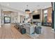 Spacious living room with a stone fireplace, comfortable seating, and an open layout perfect for entertaining and relaxation at 6690 Interstellar St, Las Vegas, NV 89135