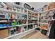 Walk-in pantry filled with organized shelves and laminate wood flooring at 6690 Interstellar St, Las Vegas, NV 89135
