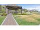 A sheltered picnic area offers shaded tables with seating, walking paths, and landscaped features for pleasant gatherings at 6690 Interstellar St, Las Vegas, NV 89135