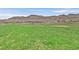 Expansive green space with lush grass, a picnic pavilion, and mountain views, offering a peaceful escape in a community park at 6690 Interstellar St, Las Vegas, NV 89135