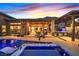 Backyard features a sparkling pool, spa, and covered patio, perfect for outdoor entertaining at 6690 Interstellar St, Las Vegas, NV 89135