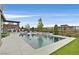Inviting backyard with a long swimming pool, spa, and well-equipped outdoor kitchen and dining area at 6690 Interstellar St, Las Vegas, NV 89135