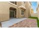 Backyard featuring a brick patio, small turf area, and low maintenance landscaping at 6712 Biltmore Garden St, Las Vegas, NV 89149