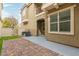 Backyard view with brick patio, low-maintenance turf, and privacy fence at 6712 Biltmore Garden St, Las Vegas, NV 89149