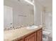Bathroom featuring granite countertop, patterned backsplash, and white toilet and bath at 6712 Biltmore Garden St, Las Vegas, NV 89149