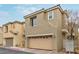 Two-story home featuring a two-car garage and neutral-colored stucco exterior at 6712 Biltmore Garden St, Las Vegas, NV 89149