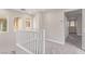Bright upstairs hallway, featuring a staircase with natural light and access to several rooms at 6712 Biltmore Garden St, Las Vegas, NV 89149