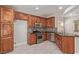 Stylish kitchen features stainless appliances, granite counters, and ample storage in beautiful wood cabinets at 6712 Biltmore Garden St, Las Vegas, NV 89149