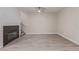 Bright living room features modern flooring, fireplace, and stylish ceiling fan for comfortable living at 6712 Biltmore Garden St, Las Vegas, NV 89149