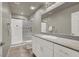 Modern bathroom featuring a walk-in shower, granite countertop vanity, and sleek fixtures at 7305 Halo Falls St, North Las Vegas, NV 89084