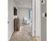 Bedroom showcasing neutral carpet, a comfortable chair, and a modern TV at 7305 Halo Falls St, North Las Vegas, NV 89084