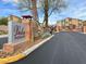 Vela Pointe community entrance with desert landscaping, monument sign, and well-maintained street at 7305 Halo Falls St, North Las Vegas, NV 89084