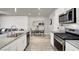 Stylish kitchen with stainless steel appliances, granite countertops, and open view to living area at 7305 Halo Falls St, North Las Vegas, NV 89084