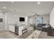 Bright living space with open layout, sleek floors, and seamless transition to the dining area at 7305 Halo Falls St, North Las Vegas, NV 89084