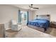Inviting bedroom boasts soft carpet, a large bed, and natural light from the window at 7305 Halo Falls St, North Las Vegas, NV 89084