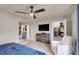 Bright main bedroom with ceiling fan, dresser, accent chair and large closet at 7305 Halo Falls St, North Las Vegas, NV 89084