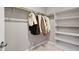 Spacious walk-in closet with hanging racks and built-in shelving for optimal organization at 7305 Halo Falls St, North Las Vegas, NV 89084