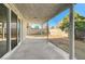 Covered back patio with views of the fenced in yard, and sliding glass door into the home at 7900 Holly Knoll Ave, Las Vegas, NV 89129