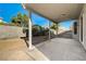 Spacious backyard with covered patio and block wall fencing, offering a private outdoor space at 7900 Holly Knoll Ave, Las Vegas, NV 89129