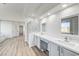 Modern bathroom with dual sinks, stylish vanities, glass enclosed shower, and luxury finishes at 7900 Holly Knoll Ave, Las Vegas, NV 89129