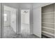 Bright bedroom featuring plush gray carpeting and multiple closets for ample storage space at 7900 Holly Knoll Ave, Las Vegas, NV 89129