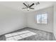 Bright bedroom features a ceiling fan, neutral paint, carpet flooring and a window allowing for plenty of natural light at 7900 Holly Knoll Ave, Las Vegas, NV 89129