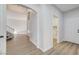 Inviting entryway features neutral paint, laminate flooring, and access to stairs and laundry room at 7900 Holly Knoll Ave, Las Vegas, NV 89129