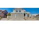 Stunning two-story home with a three-car garage and manicured landscaping at 7900 Holly Knoll Ave, Las Vegas, NV 89129
