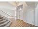 Bright foyer with a staircase and modern light fixture at 7900 Holly Knoll Ave, Las Vegas, NV 89129