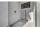 A welcoming entryway features double doors and a modern light fixture at 7900 Holly Knoll Ave, Las Vegas, NV 89129